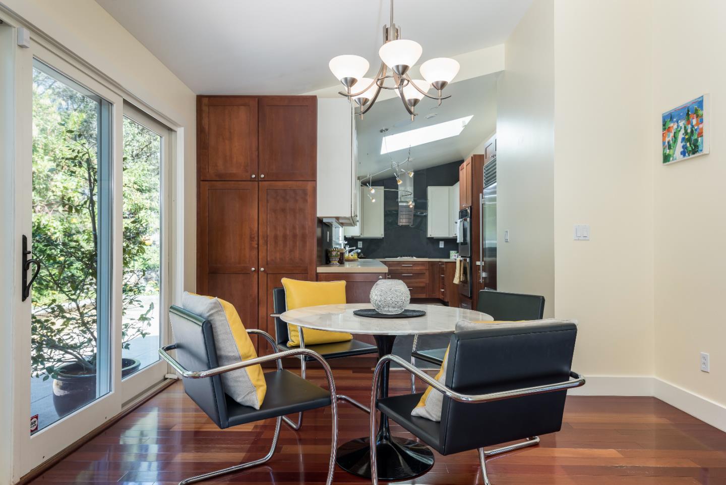20 Ridgeway Road Hillsborough, CA 94010 - Photo 9 of 31 a view of a dining room with furniture wooden floor and chandelier