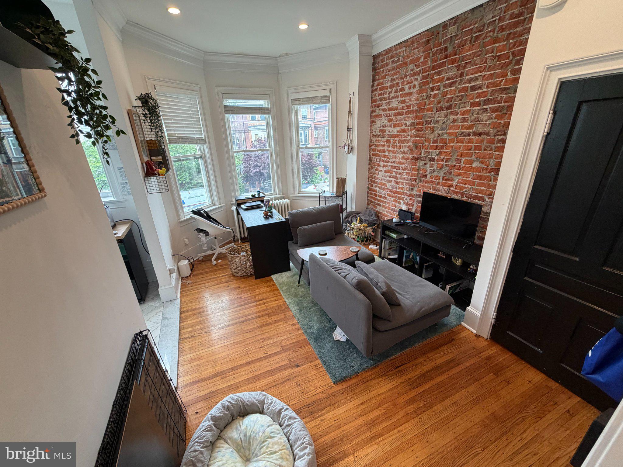 815 South 49th Street Philadelphia, PA 19143 - Photo 17 of 72 a living room with furniture bathtub and a fireplace