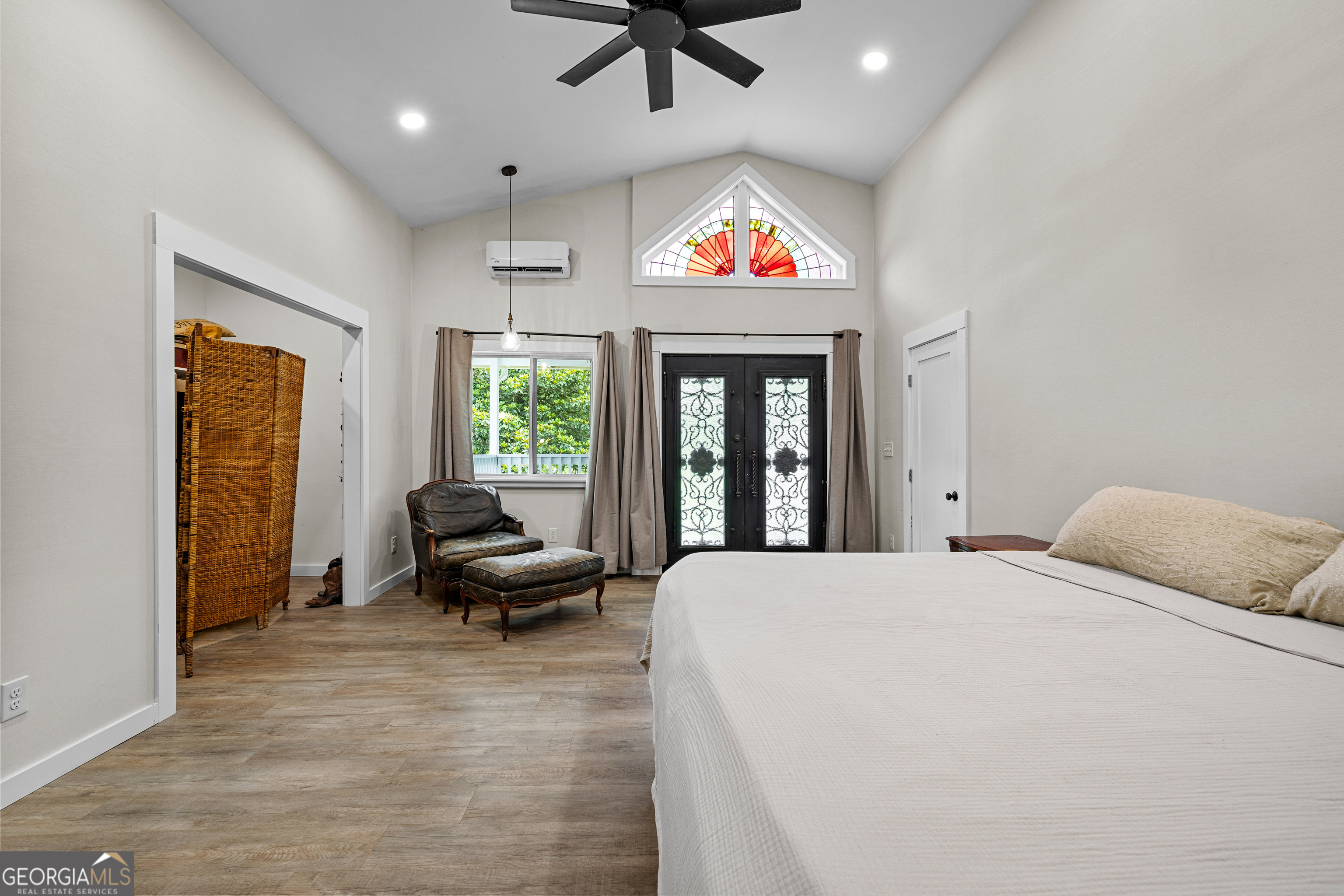 1329 Standing Rock Road Senoia, GA 30276 - Photo 23 of 77 a bedroom with furniture and a large window