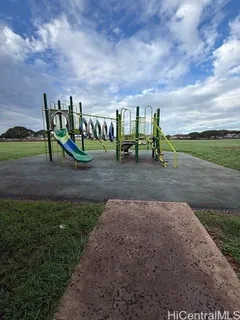 a view of a yard with trampoline