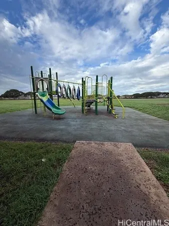 a view of a yard with trampoline
