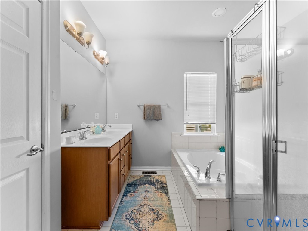 7434 South Franklins Way Quinton, VA 23141 - Photo 16 of 31 Bathroom featuring a dual-sink vanity with wood ca
