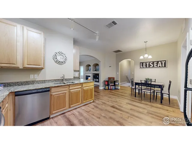 a kitchen with a dining table and chairs