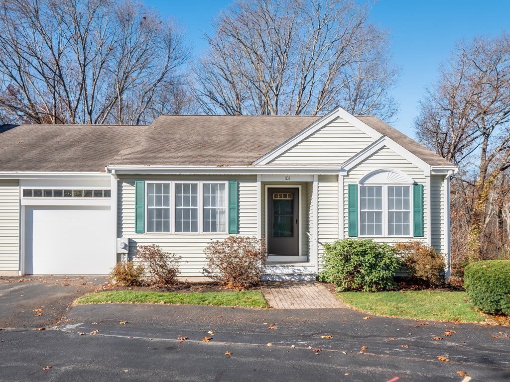 101 Stow Road, Unit 7 Boxborough, MA 01719 - Photo 1 of 32 a front view of a house with a garden and yard
