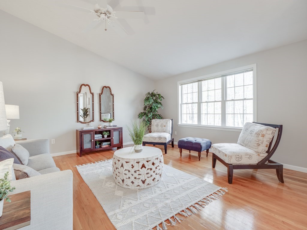 101 Stow Road, Unit 7 Boxborough, MA 01719 - Photo 9 of 32 a living room with furniture and a large window