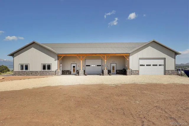 a big house with a big yard and large trees
