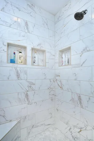 a bedroom with a bed and a mirror