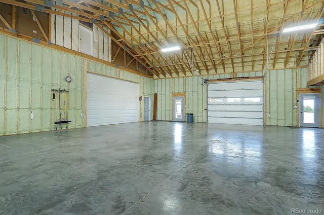 a view of a hall with wooden floor