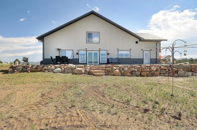 a view of a terrace with furniture and a ocean view