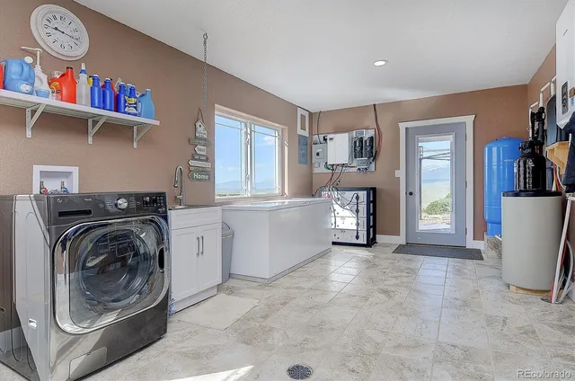 a view of a livingroom with furniture and a window
