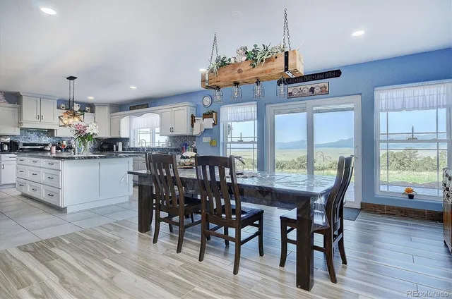 a large kitchen with lots of counter space and stainless steel appliances