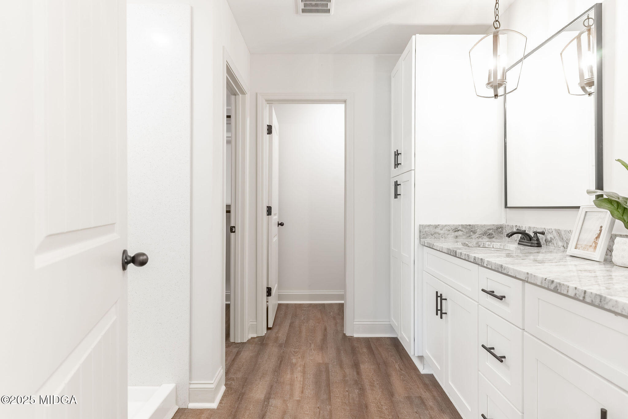 116 Fred Court Macon, GA 31216 - Photo 15 of 27 a bathroom with a granite countertop sink a mirror and a shower