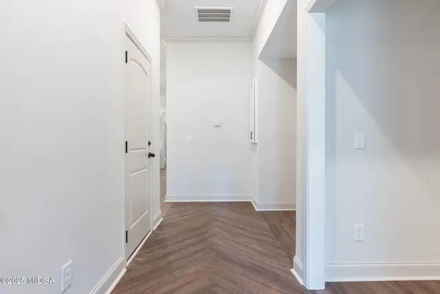 a view of a bathroom from a hallway