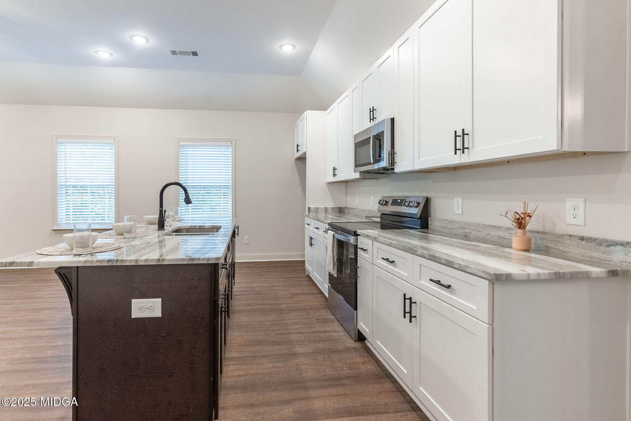 116 Fred Court Macon, GA 31216 - Photo 6 of 27 a kitchen with stainless steel appliances granite countertop a sink stove and cabinets
