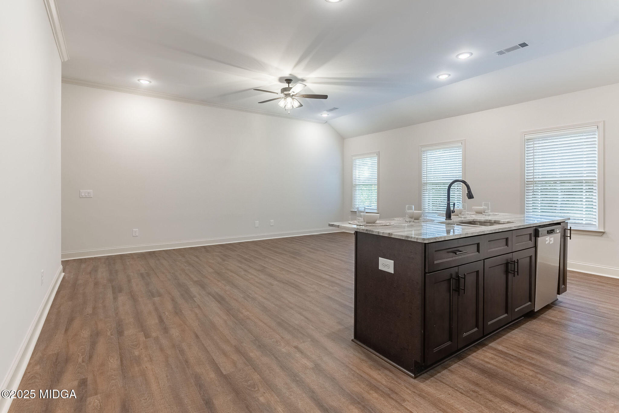 116 Fred Court Macon, GA 31216 - Photo 9 of 27 a kitchen with stainless steel appliances granite countertop a sink cabinets and wooden floor