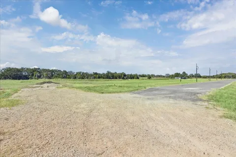 a view of a lake and green space
