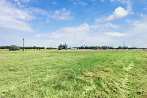 a view of a swimming pool and a yard