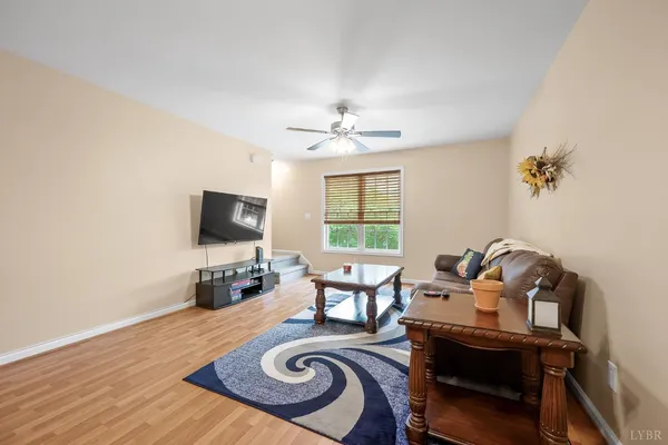 a spacious bedroom with a bed and a window