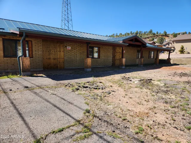 a house view with a wooden fence