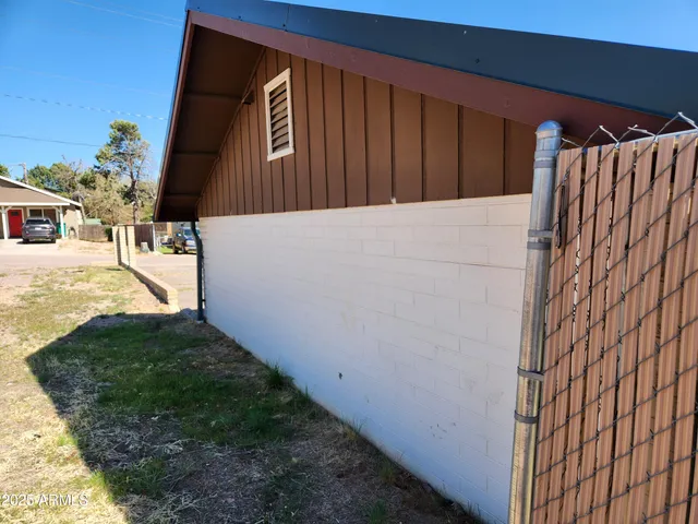 a view of a brick house with many windows