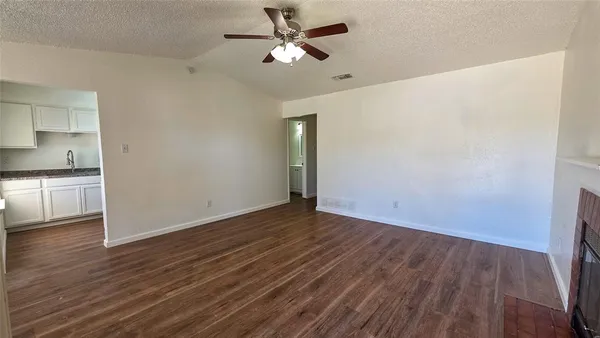 a view of a livingroom with wooden floor