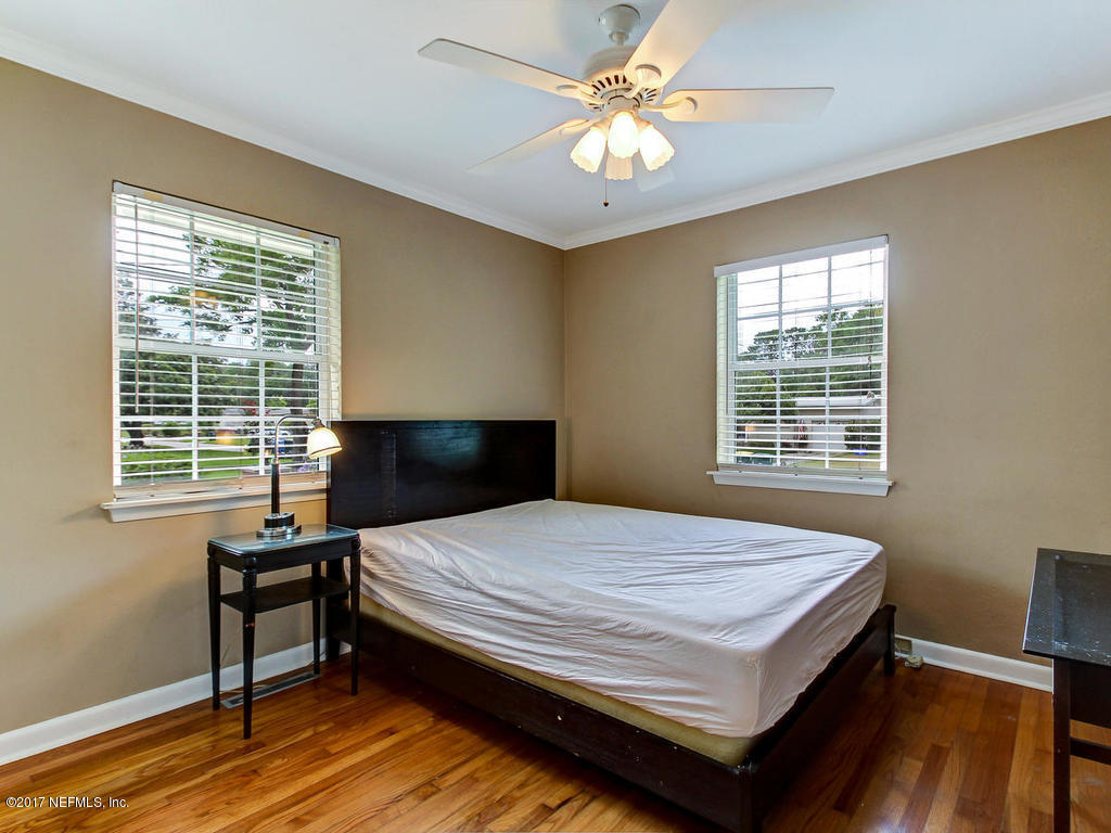 3754 Coronado Road Jacksonville, FL 32217 - Photo 12 of 19 a bedroom with a bed window and a table
