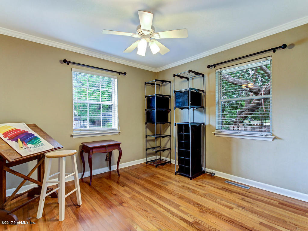 3754 Coronado Road Jacksonville, FL 32217 - Photo 13 of 19 a view of workspace with furniture window and wooden floor
