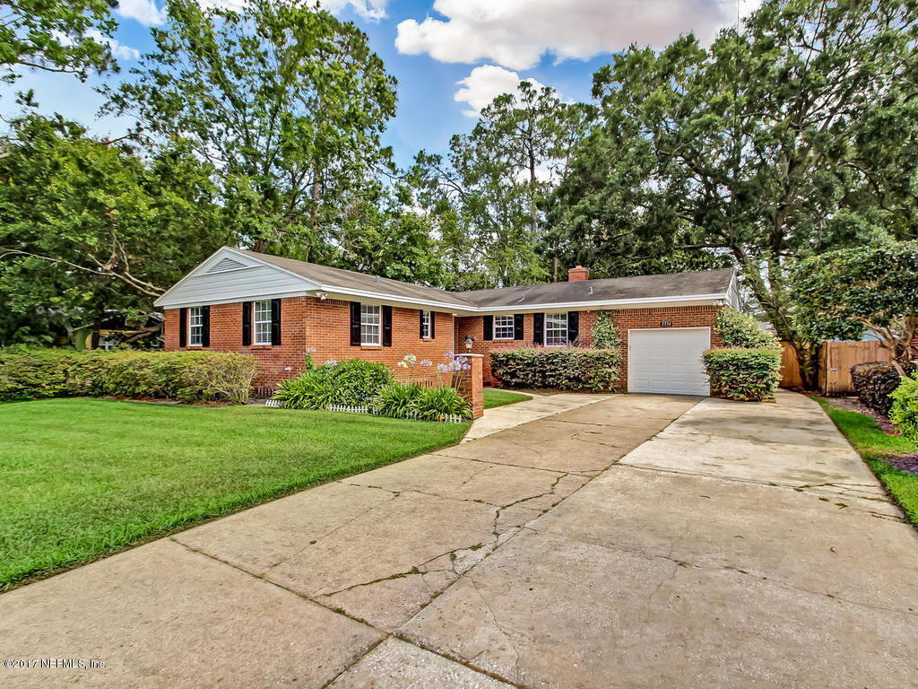 3754 Coronado Road Jacksonville, FL 32217 - Photo 18 of 19 a front view of a house with a yard and trees