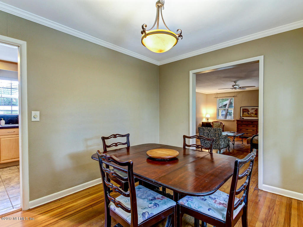 3754 Coronado Road Jacksonville, FL 32217 - Photo 4 of 19 a view of a dining room with furniture and wooden floor
