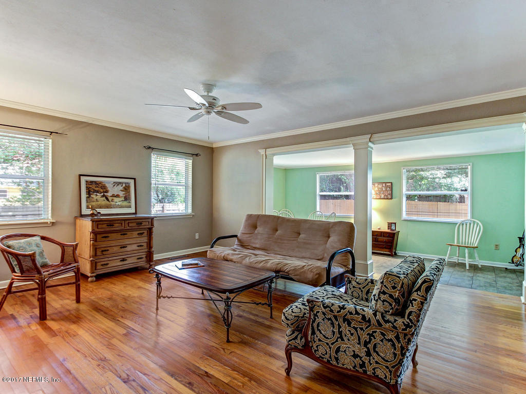 3754 Coronado Road Jacksonville, FL 32217 - Photo 6 of 19 a living room with furniture and a wooden floor