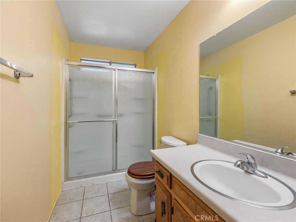1725 Linnet Road Wrightwood, CA 92397 - Photo 12 of 35 a bathroom with a sink toilet and shower