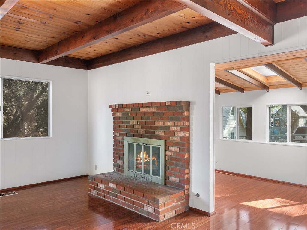 1725 Linnet Road Wrightwood, CA 92397 - Photo 13 of 43 a living room with furniture and a fireplace