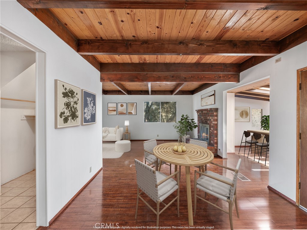 1725 Linnet Road Wrightwood, CA 92397 - Photo 14 of 43 a view of a dining room with furniture window and wooden floor