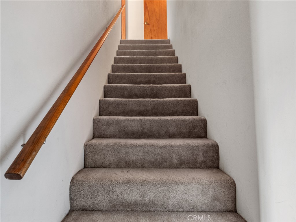 1725 Linnet Road Wrightwood, CA 92397 - Photo 16 of 35 a living room with furniture and a stairs