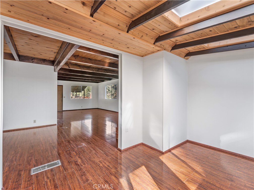 1725 Linnet Road Wrightwood, CA 92397 - Photo 18 of 43 a view of a hallway with wooden floor