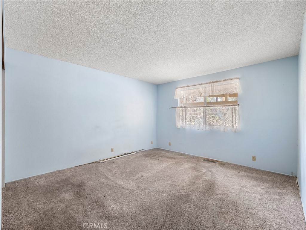 1725 Linnet Road Wrightwood, CA 92397 - Photo 21 of 43 an empty room with windows