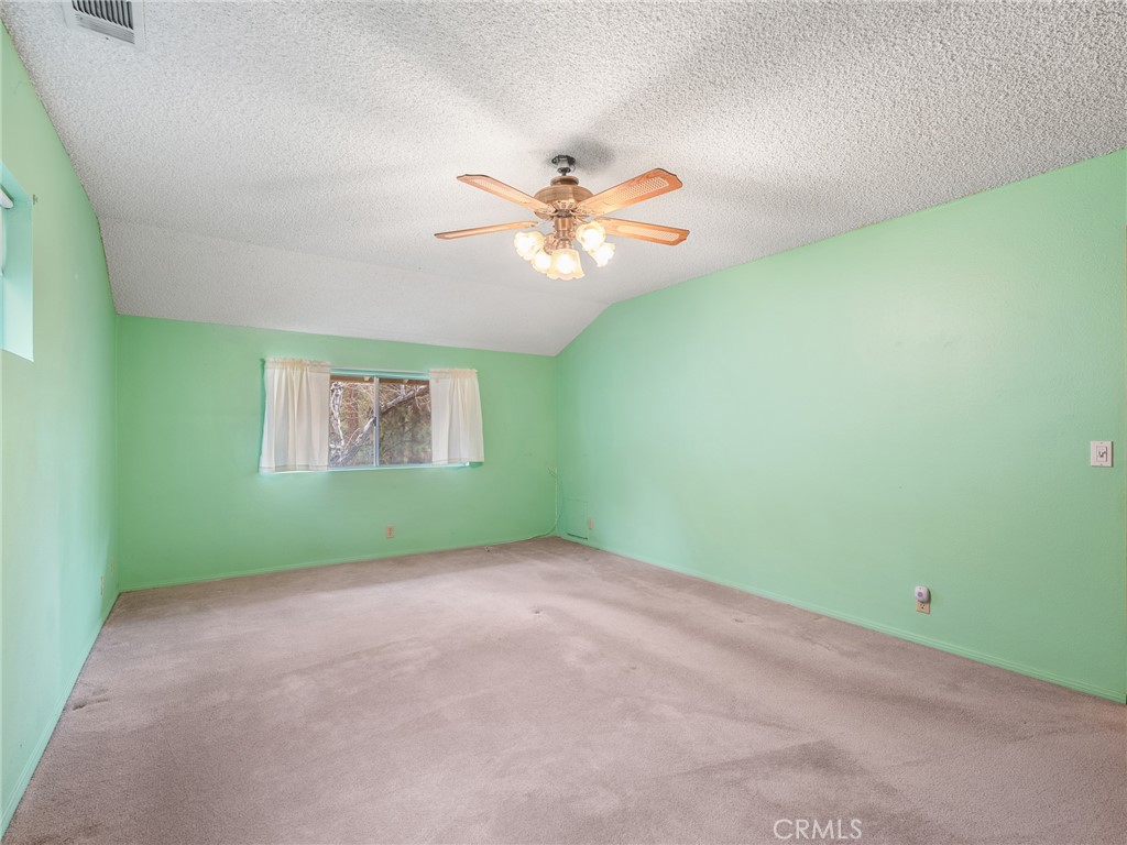 1725 Linnet Road Wrightwood, CA 92397 - Photo 21 of 35 an empty room with fan and window