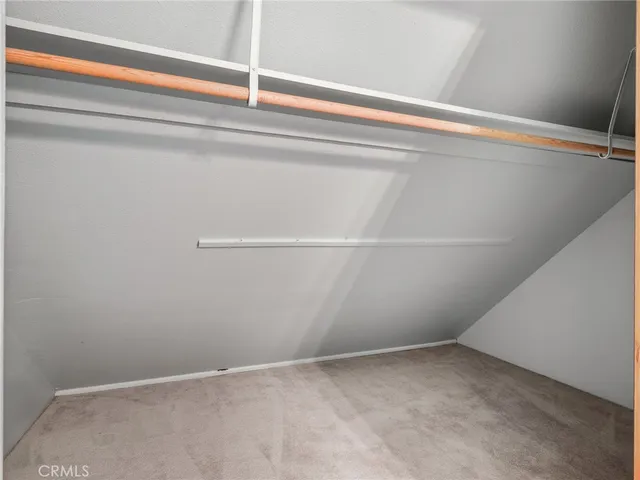 a view of a house with a yard covered in snow