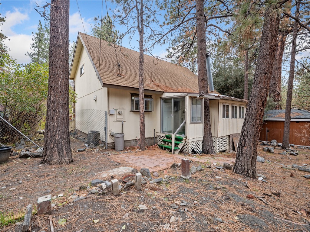 1725 Linnet Road Wrightwood, CA 92397 - Photo 35 of 43 a view of a house with a yard covered in snow