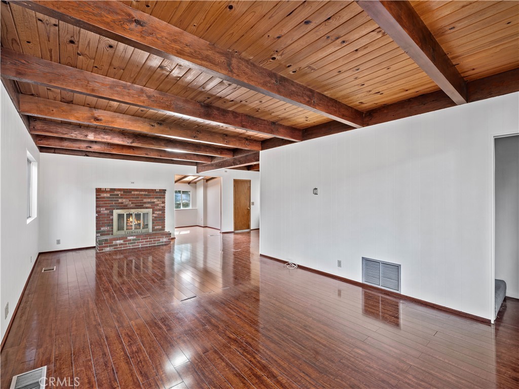 1725 Linnet Road Wrightwood, CA 92397 - Photo 4 of 43 a view of empty room with wooden floor