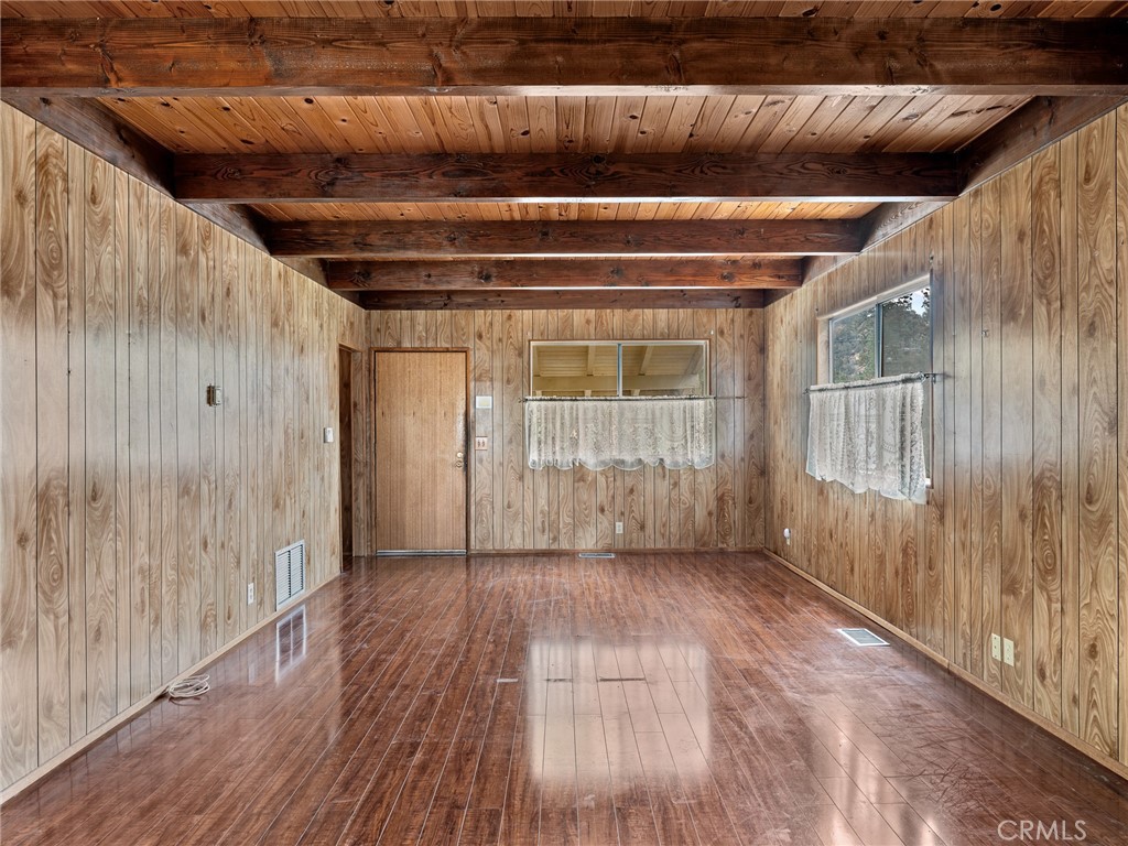 1725 Linnet Road Wrightwood, CA 92397 - Photo 5 of 35 a view of an empty room with wooden floor