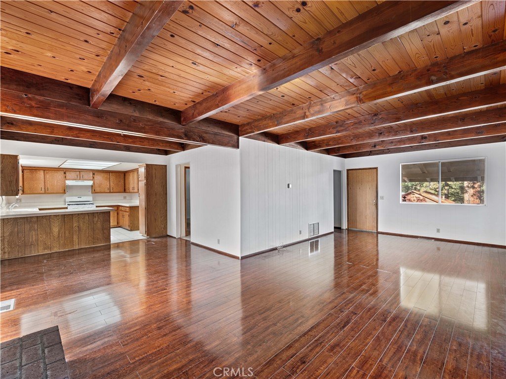 1725 Linnet Road Wrightwood, CA 92397 - Photo 6 of 43 a view of an empty room with wooden floor