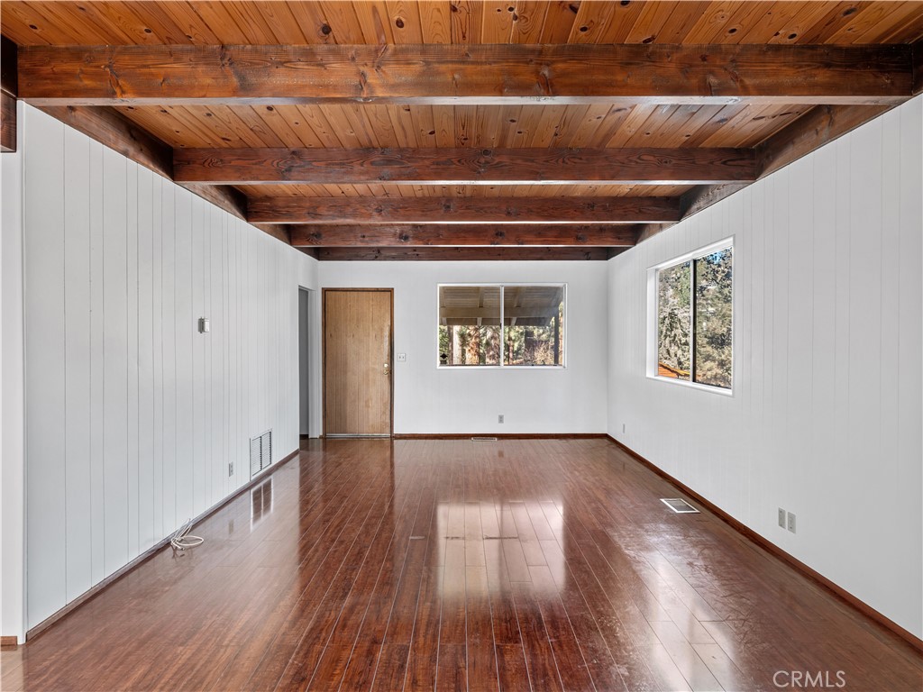 1725 Linnet Road Wrightwood, CA 92397 - Photo 8 of 43 a view of an empty room with wooden floor