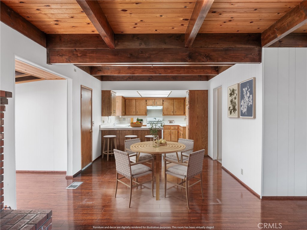 1725 Linnet Road Wrightwood, CA 92397 - Photo 9 of 43 a view of a dining room with furniture and wooden floor
