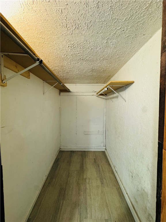 713 Jane Street Corpus Christi, TX 78418 - Photo 13 of 18 a view of a room with wooden floor and small window