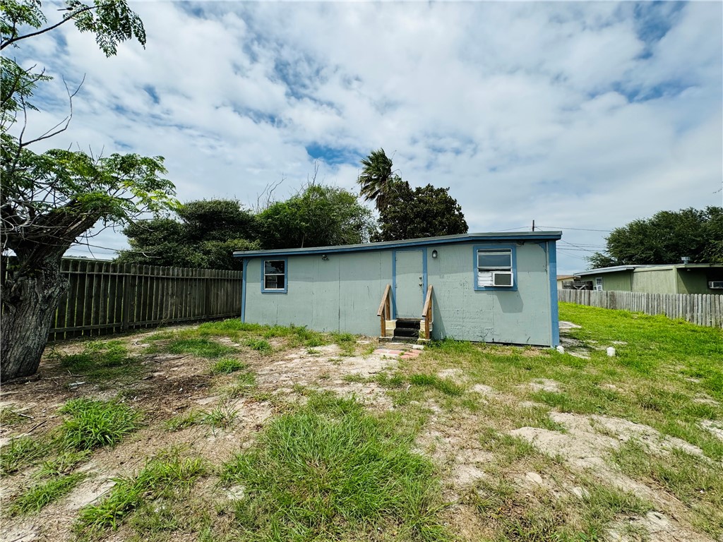 713 Jane Street Corpus Christi, TX 78418 - Photo 18 of 18 a backyard of a house with plants and lake view