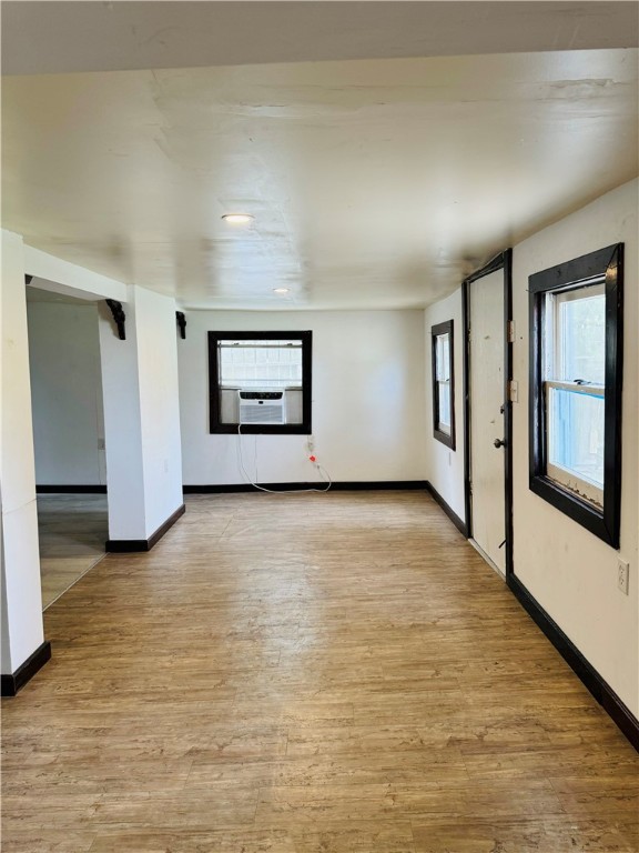 713 Jane Street Corpus Christi, TX 78418 - Photo 5 of 18 a view of an empty room with window and wooden floor