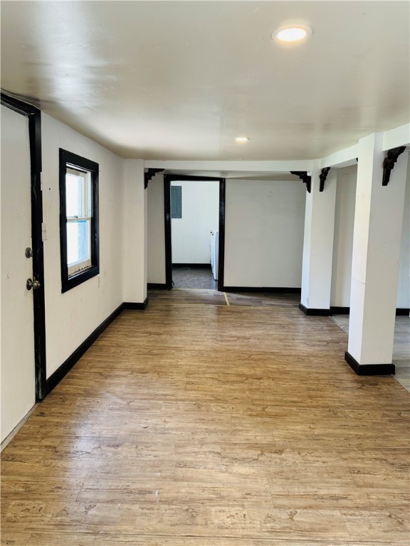 713 Jane Street Corpus Christi, TX 78418 - Photo 6 of 18 a view of an empty room with wooden floor and a window