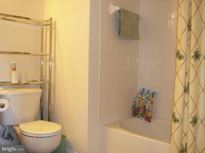 654 Wild Hunt Road Frederick, MD 21703 - Photo 4 of 17 a white toilet sitting next to a bath tub