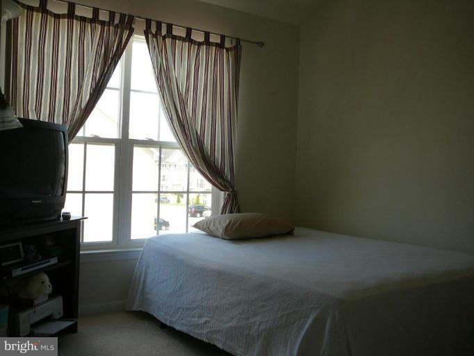 654 Wild Hunt Road Frederick, MD 21703 - Photo 9 of 17 a bedroom with a bed and a window